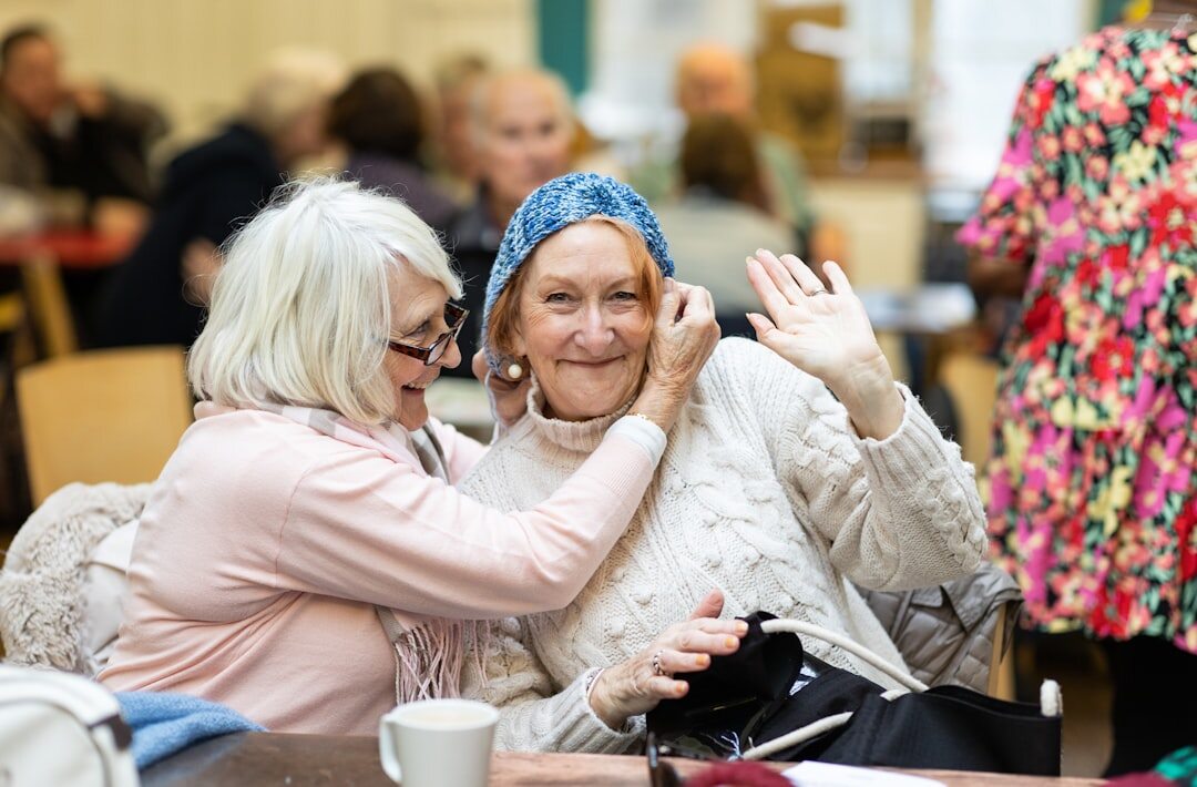 elderly friends laughing together