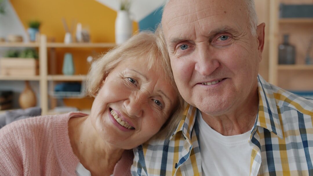 happy elderly couple smiling