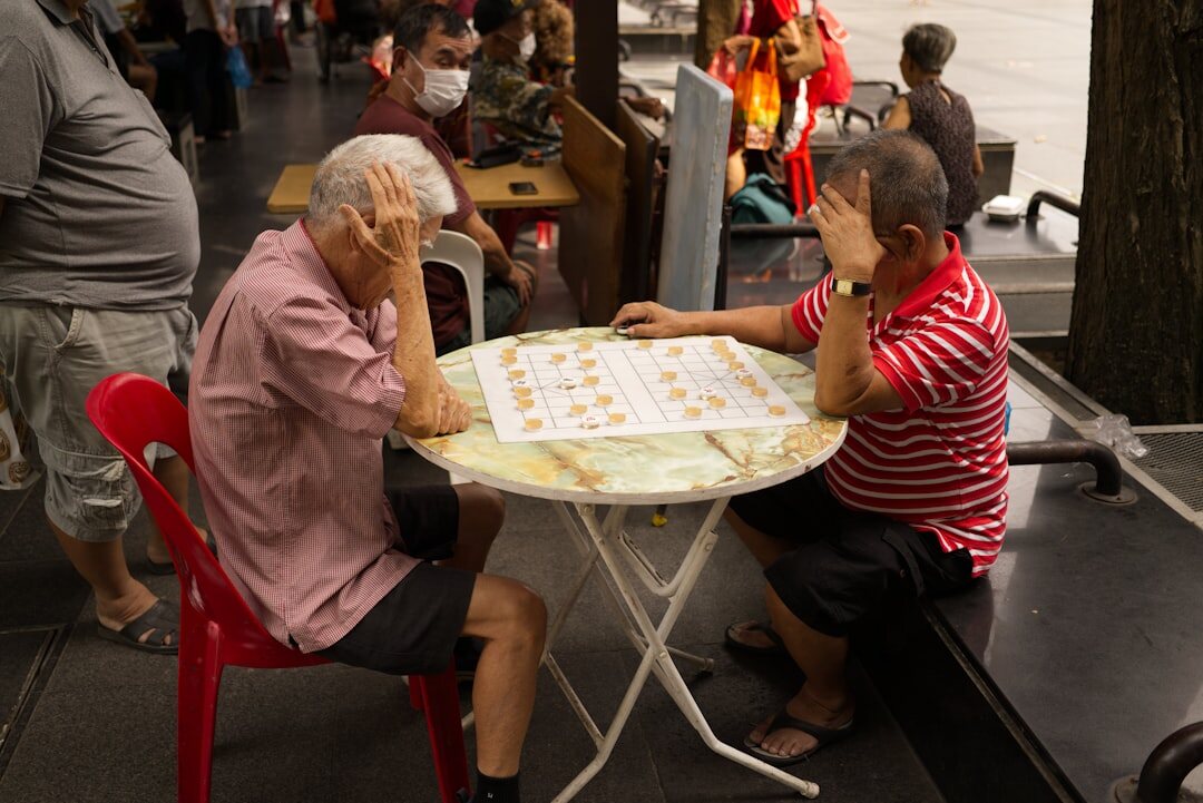 elderly people playing board games