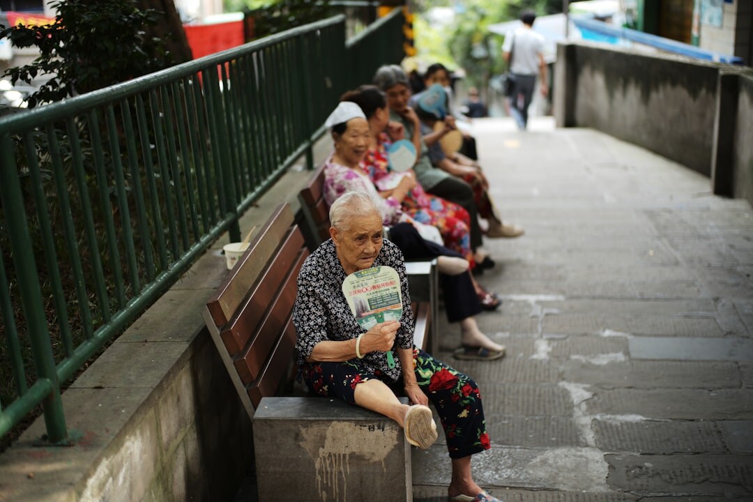 elderly woman reading book